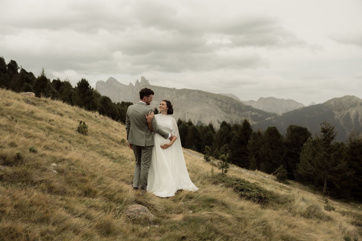 Couple on an alpine meadow with mountain view