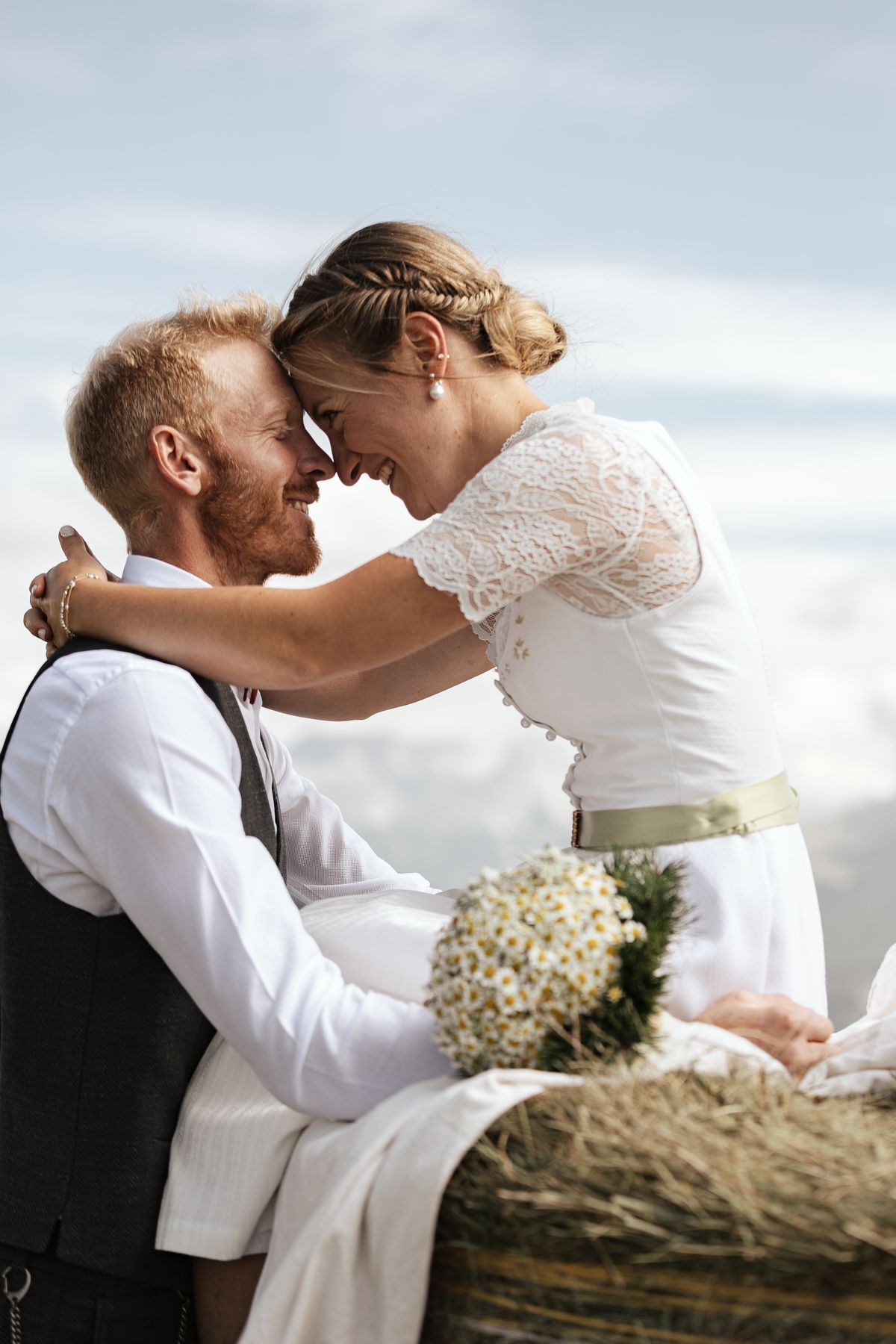 Couple forehead to forehead in traditional dress