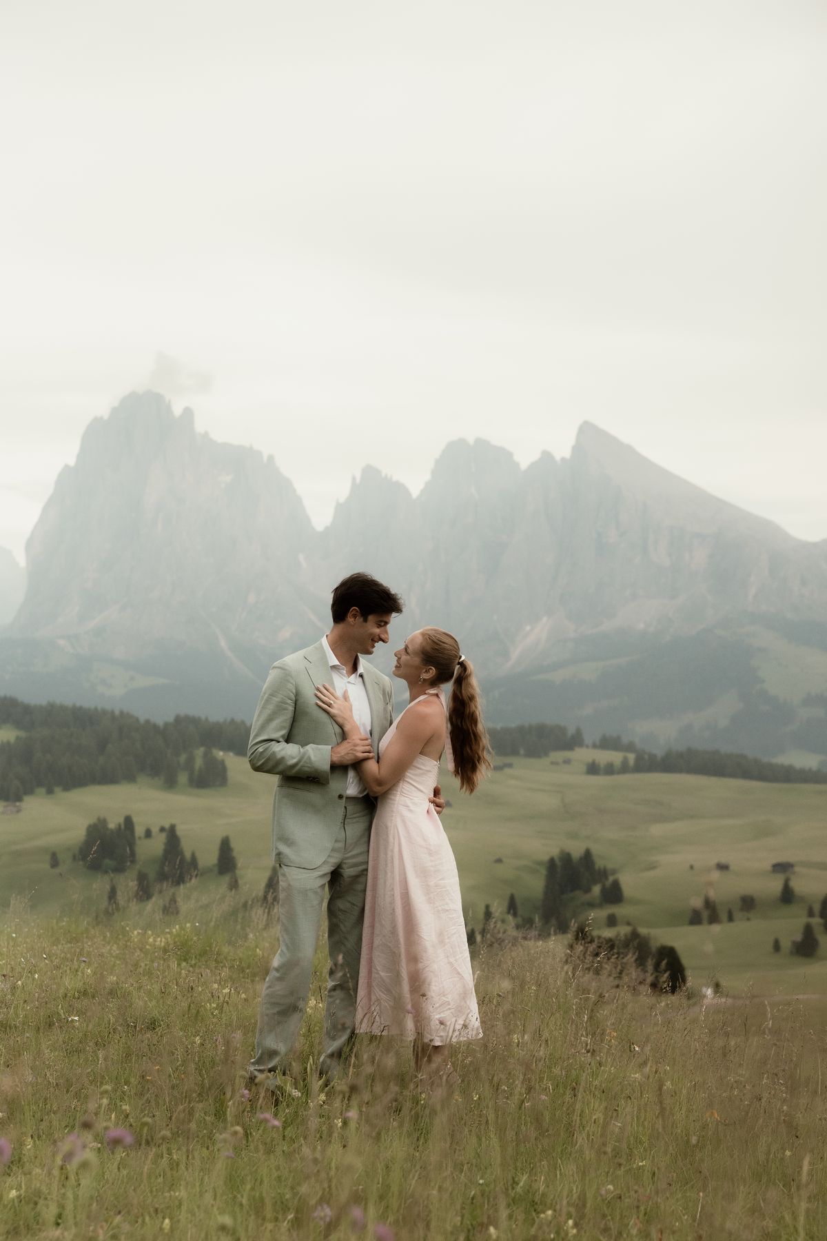 Couple on a meadow below Sassolungo