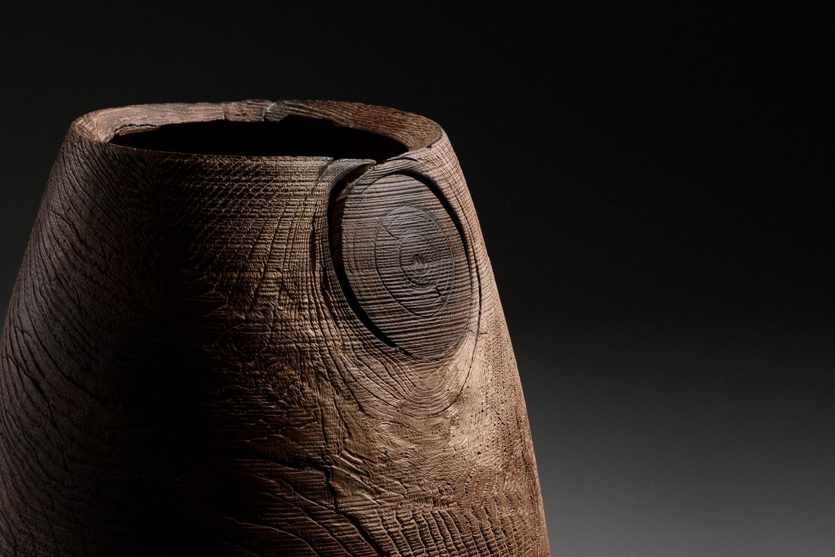 Wooden vessel with knot hole in detail