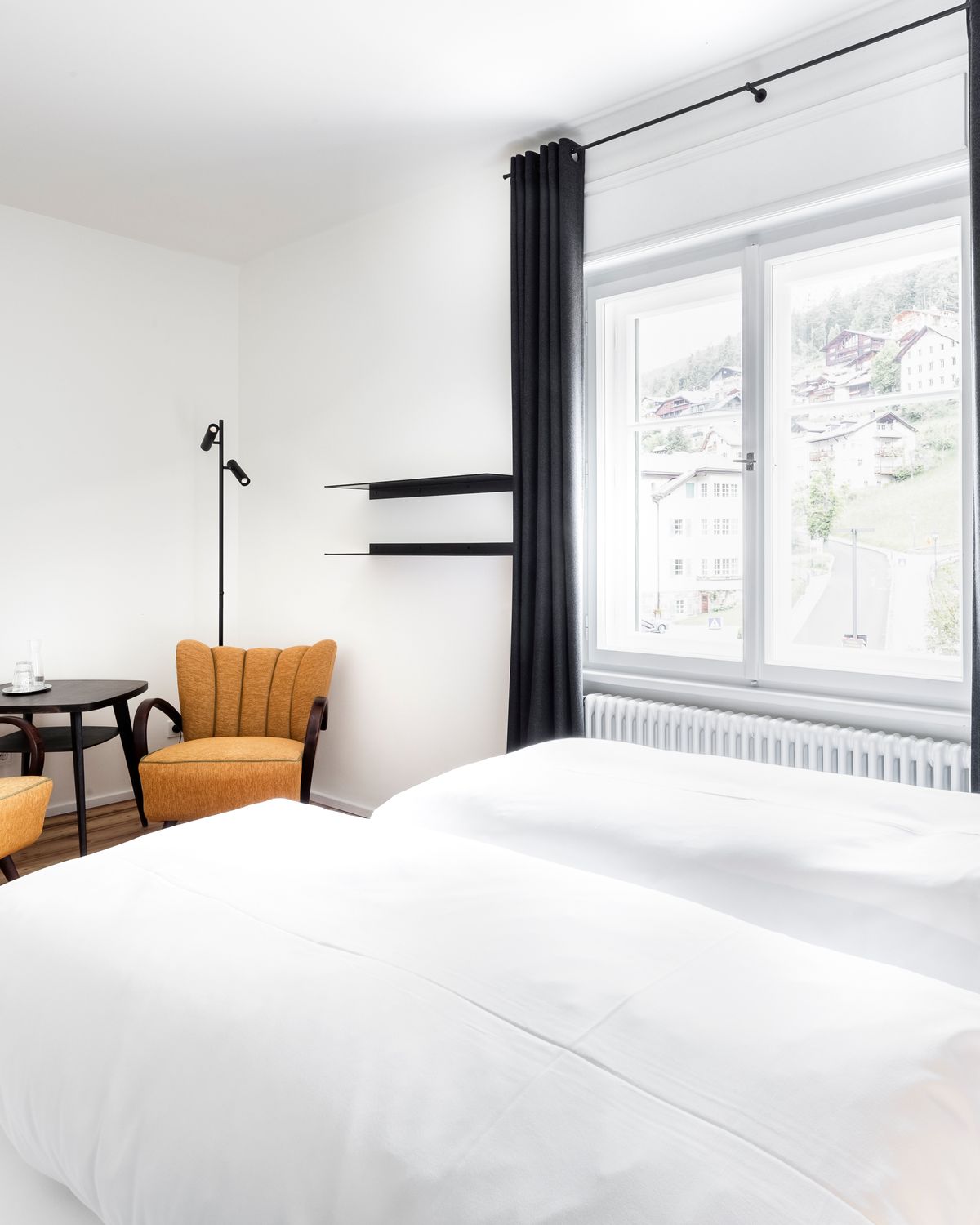 Room with yellow armchairs and double bed