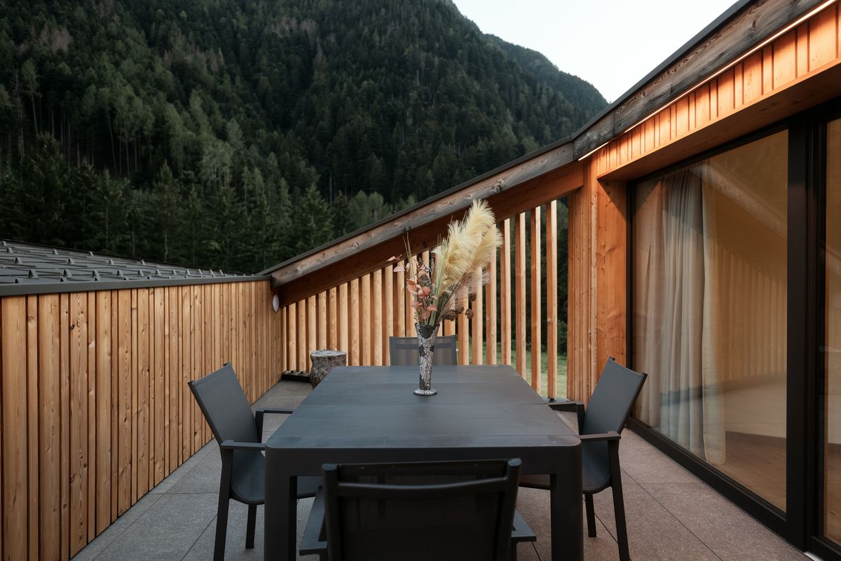 Terrace with timber cladding and table