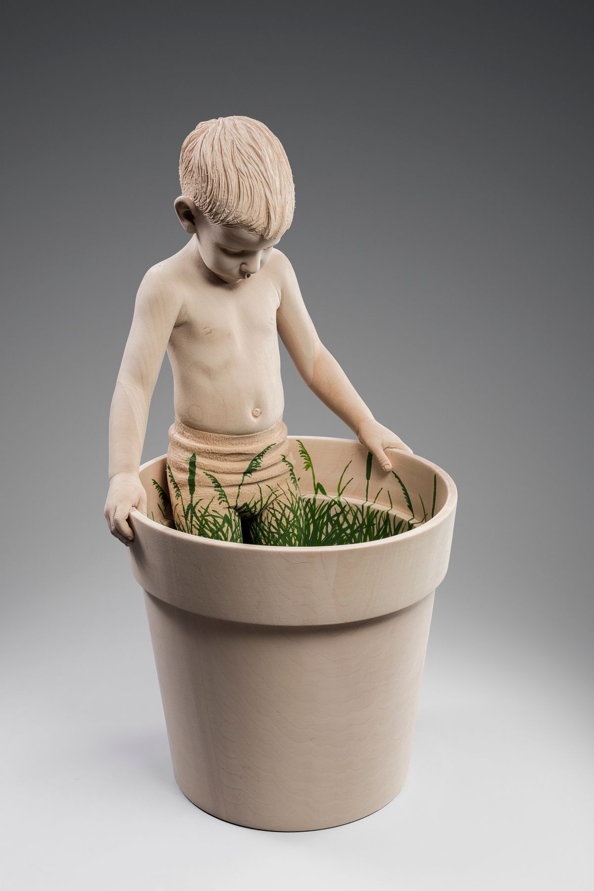 Boy in a flowerpot