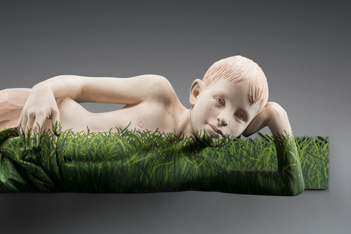 Boy lying in the grass