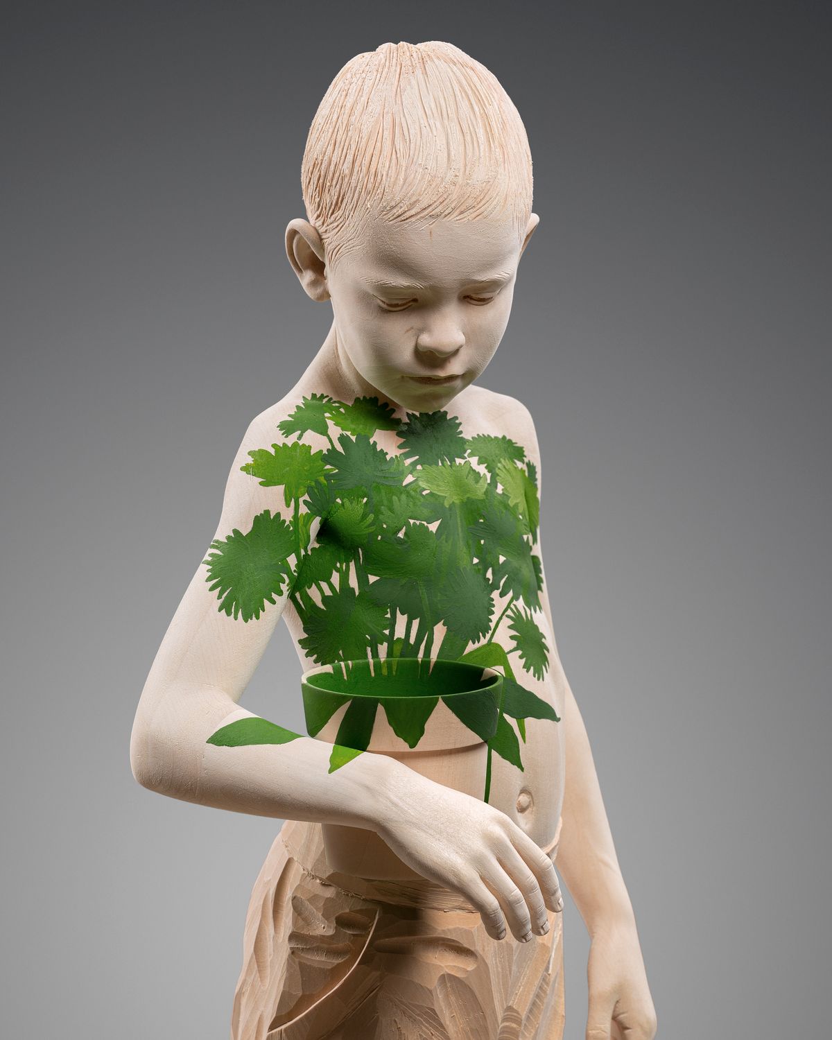 Boy with leaves on his torso