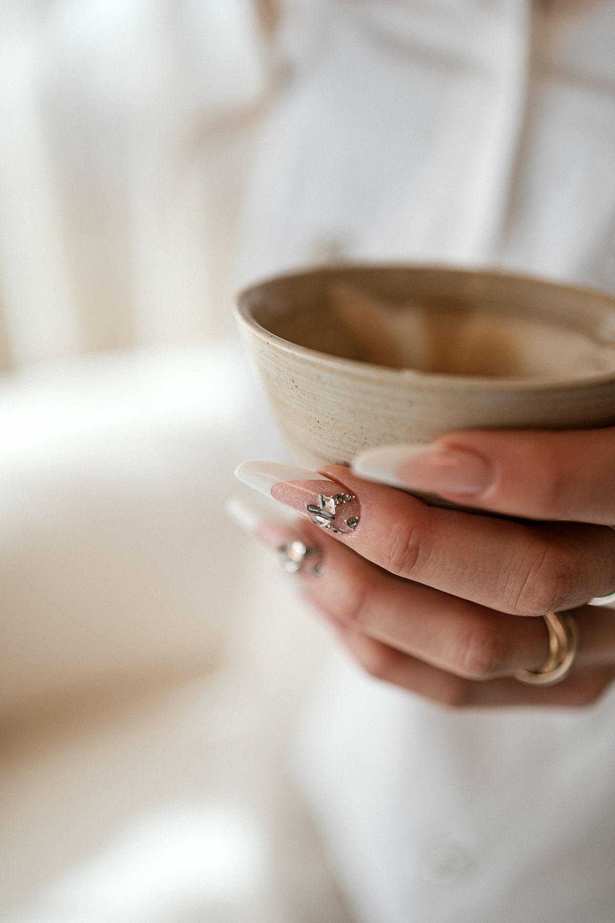Hand holding a ceramic bowl