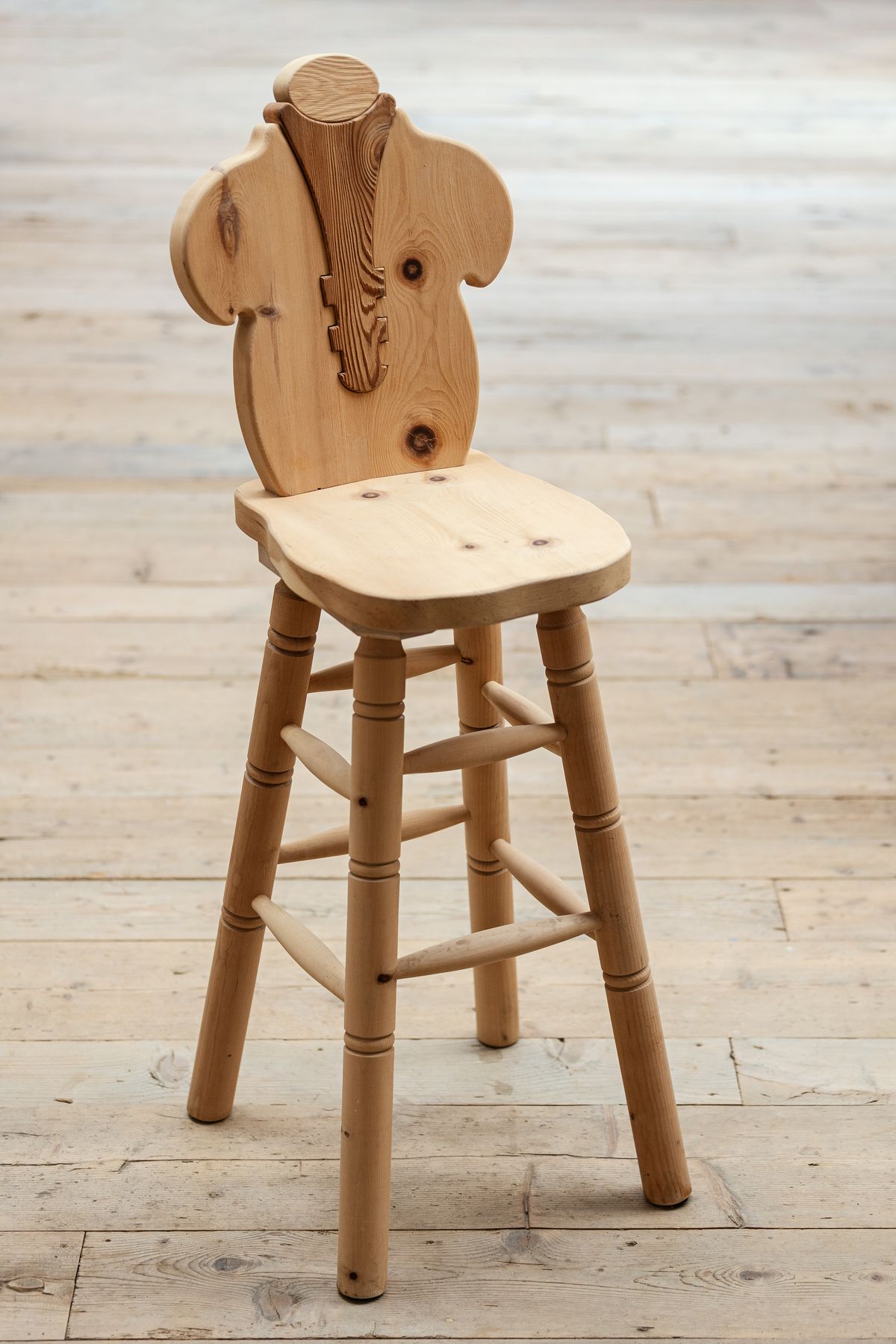 Bar stool with carved back
