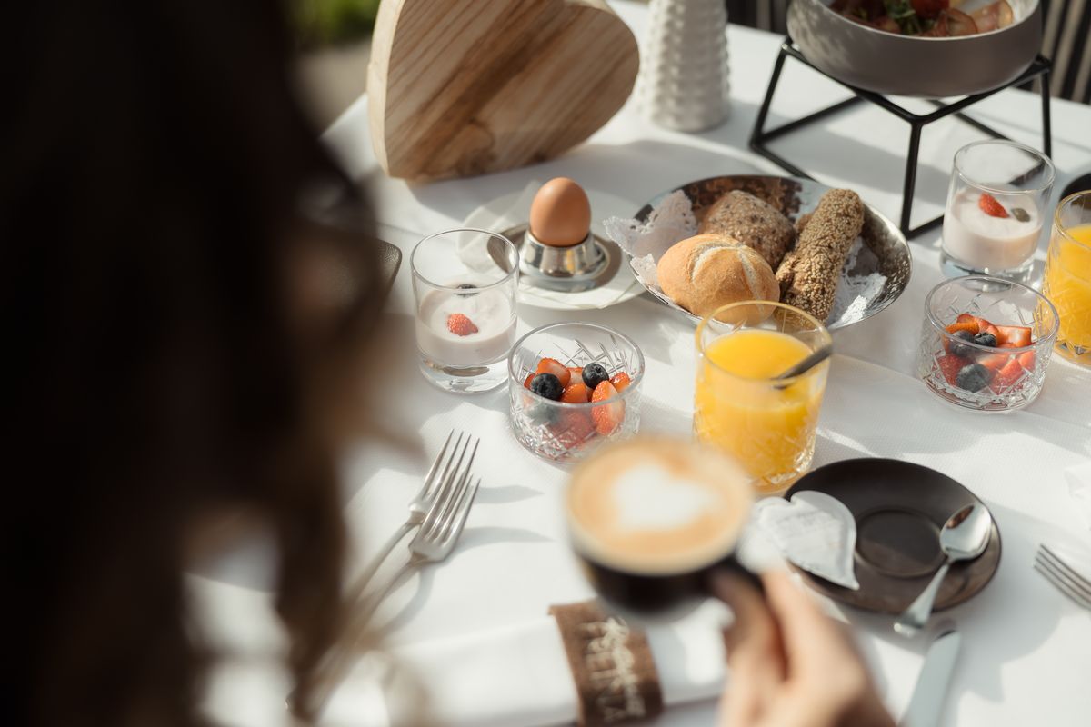 Breakfast table with cappuccino and pastries