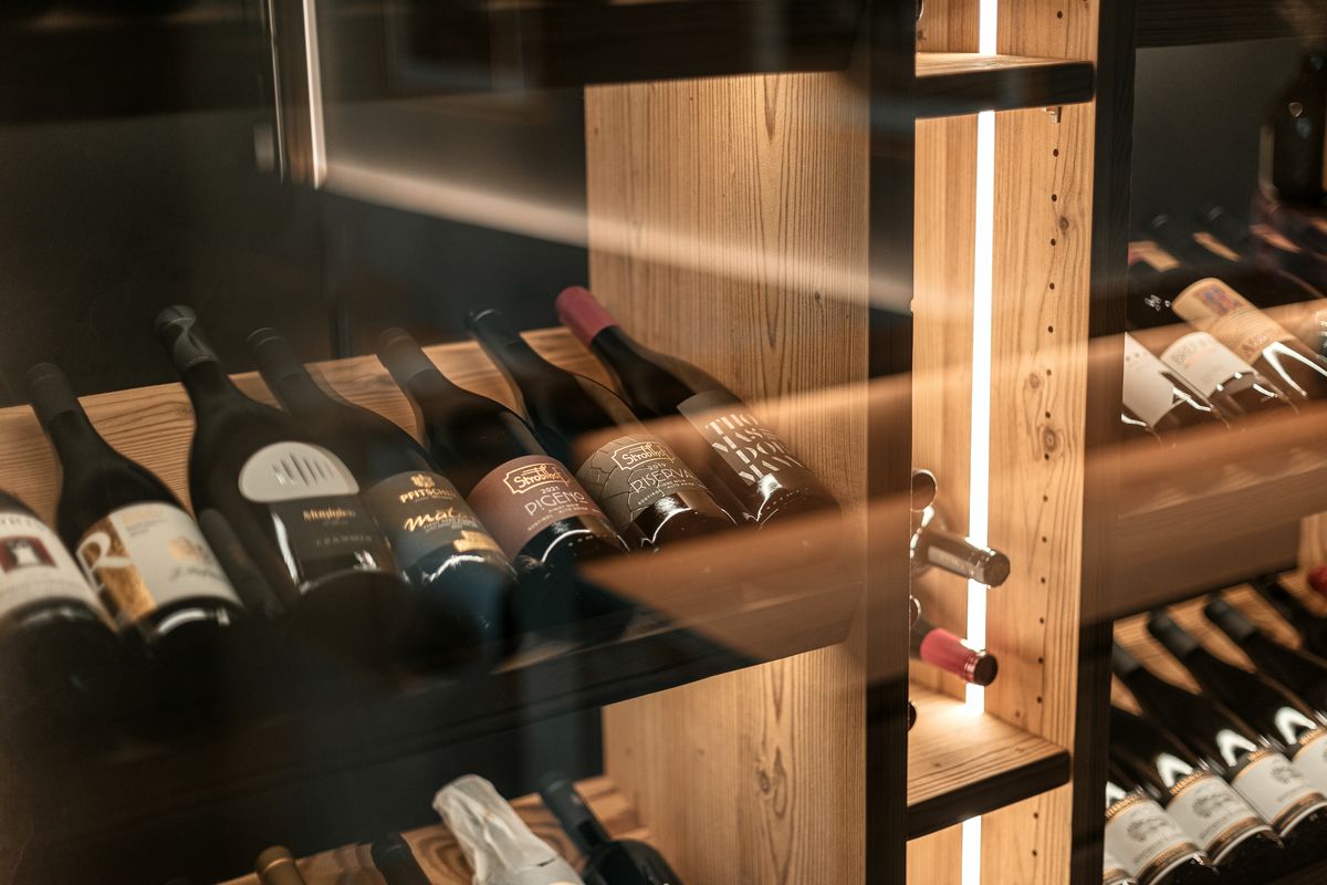 Wine bottles on the lit rack
