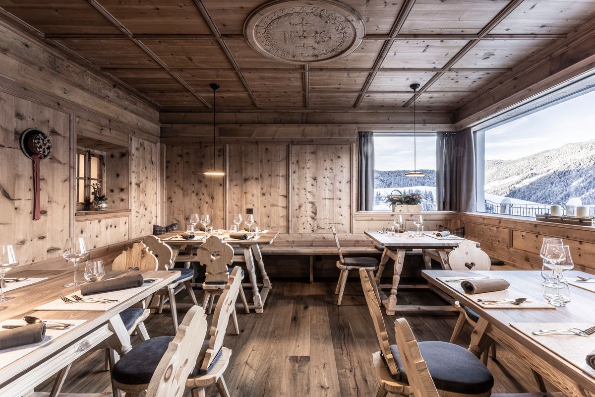 Parlour with wooden ceiling and set tables