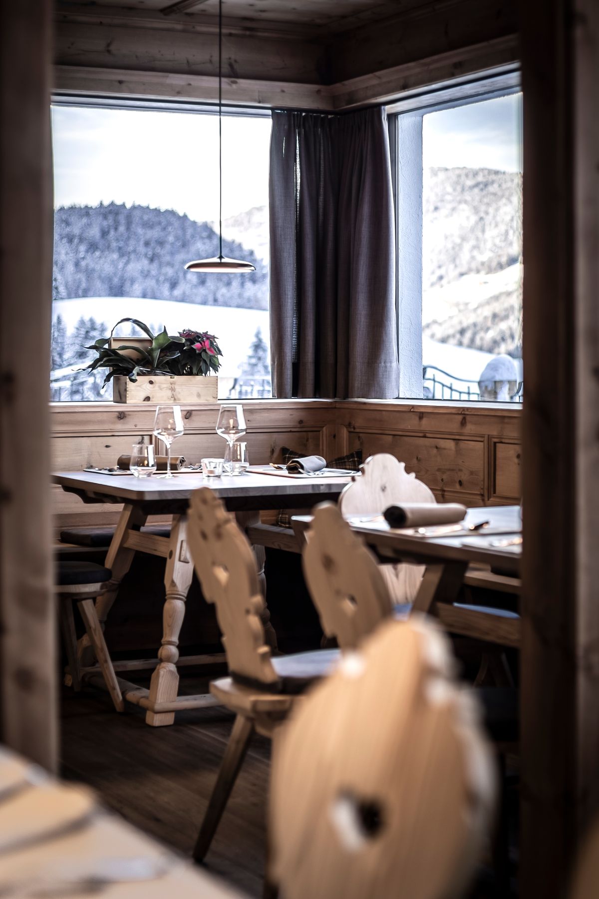 Set table in the parlour overlooking snowy mountains