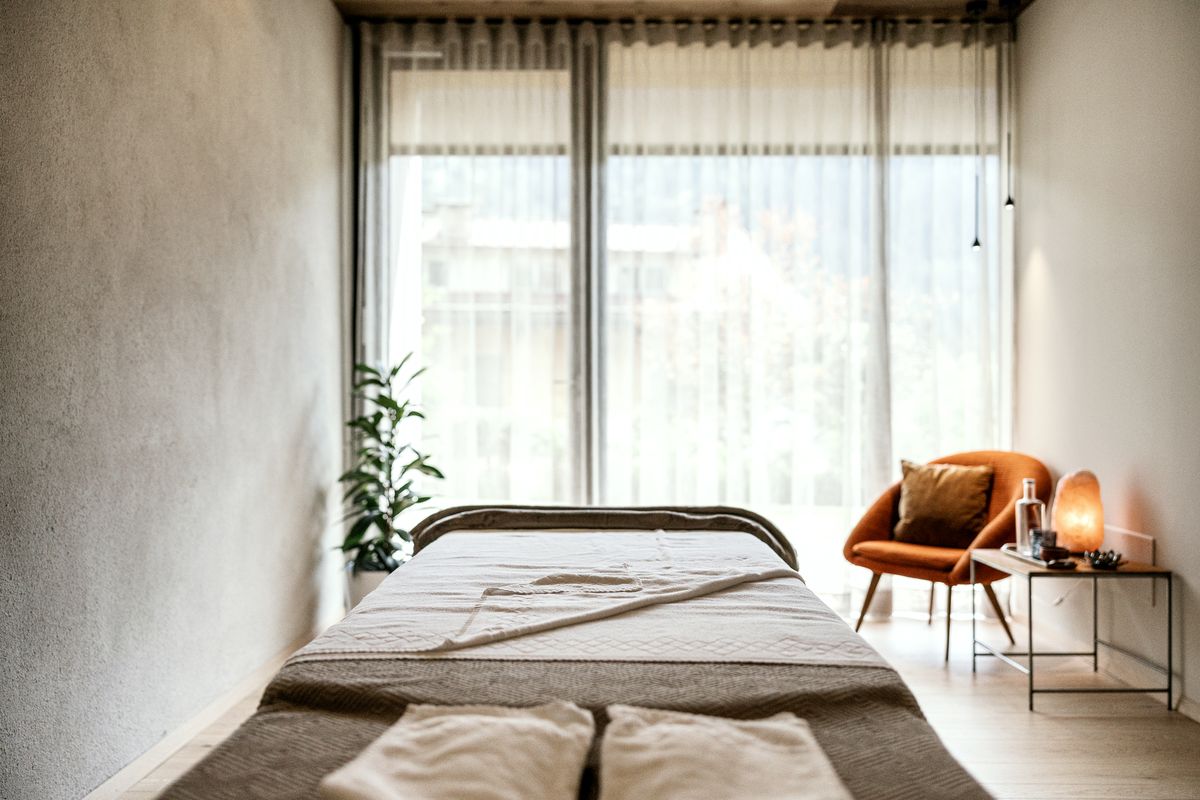 Treatment room with a couch by the window