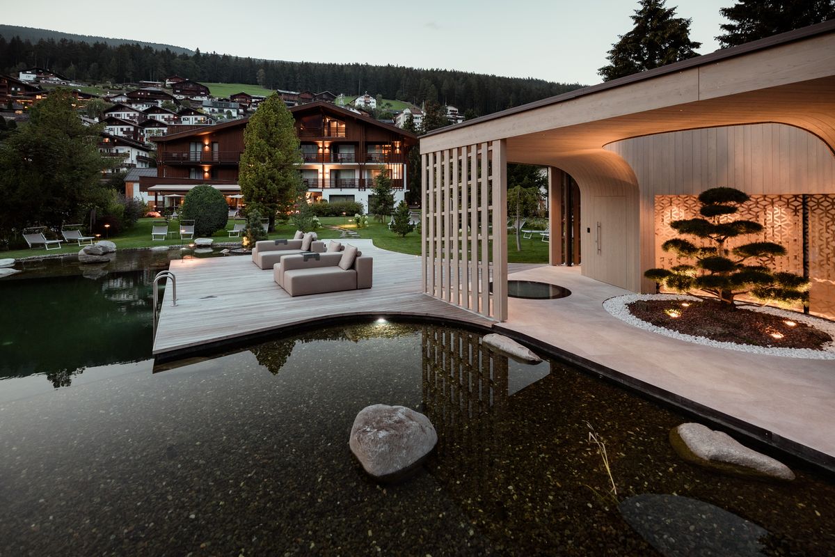 Swimming pond with sun deck and pavilion