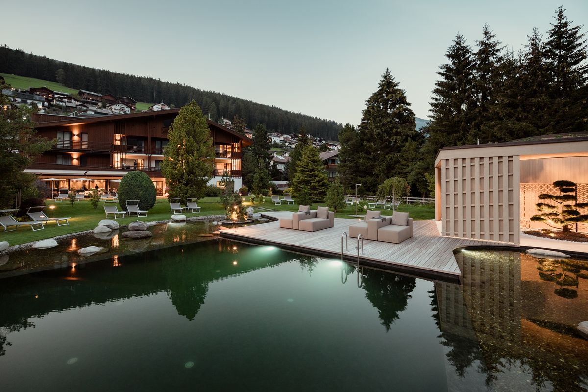 Swimming pond and hotel at dusk