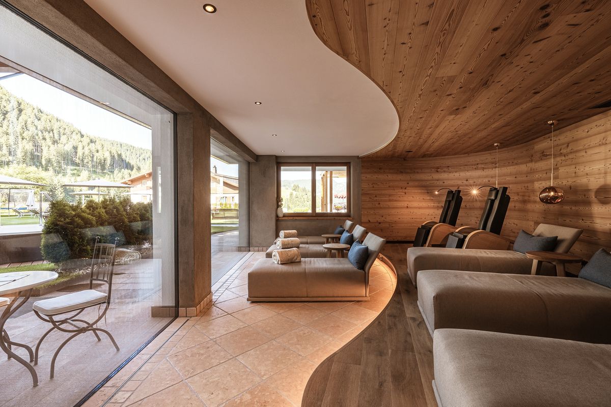 Relaxation room with loungers and garden view