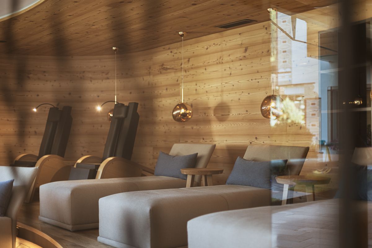 Relaxation room with wooden wall and loungers