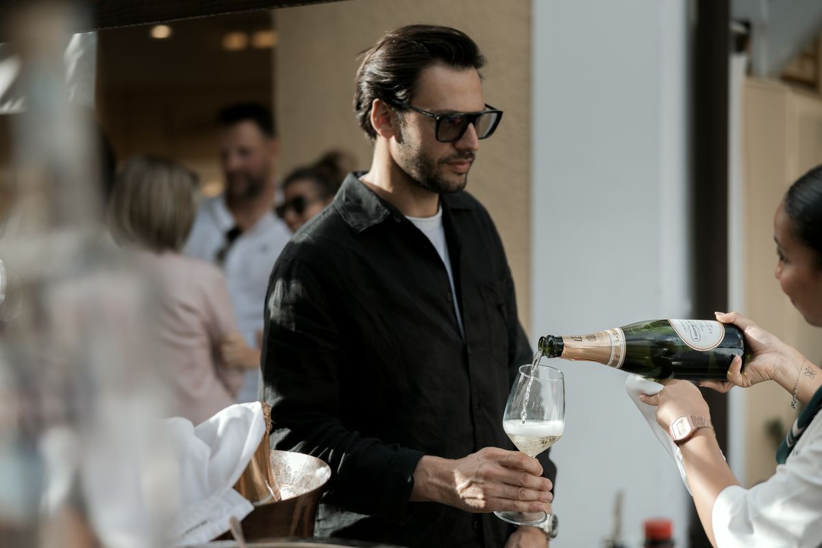 Guest with a glass of sparkling wine