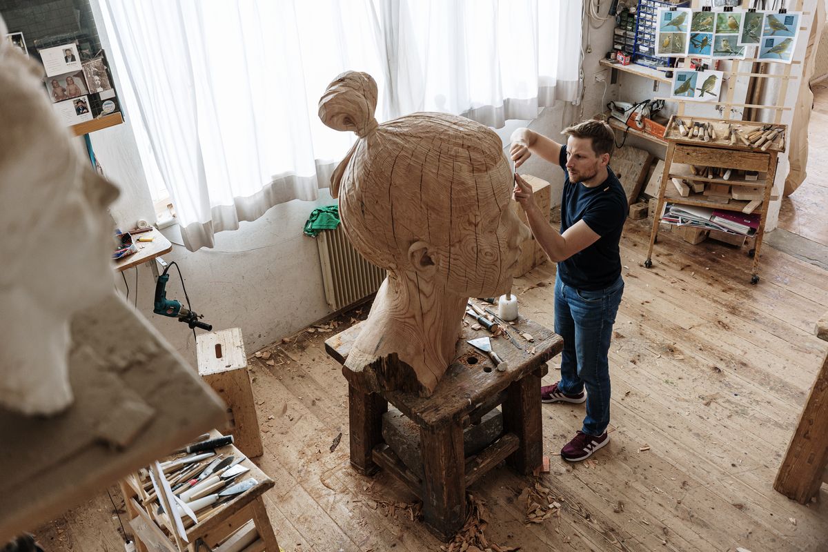 Sculptor in his studio