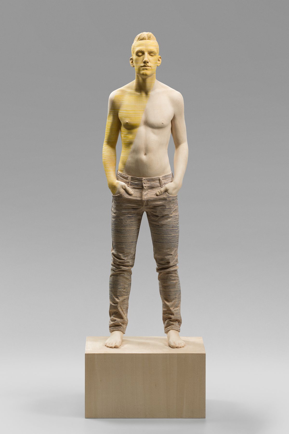 Wooden figure with yellow paint