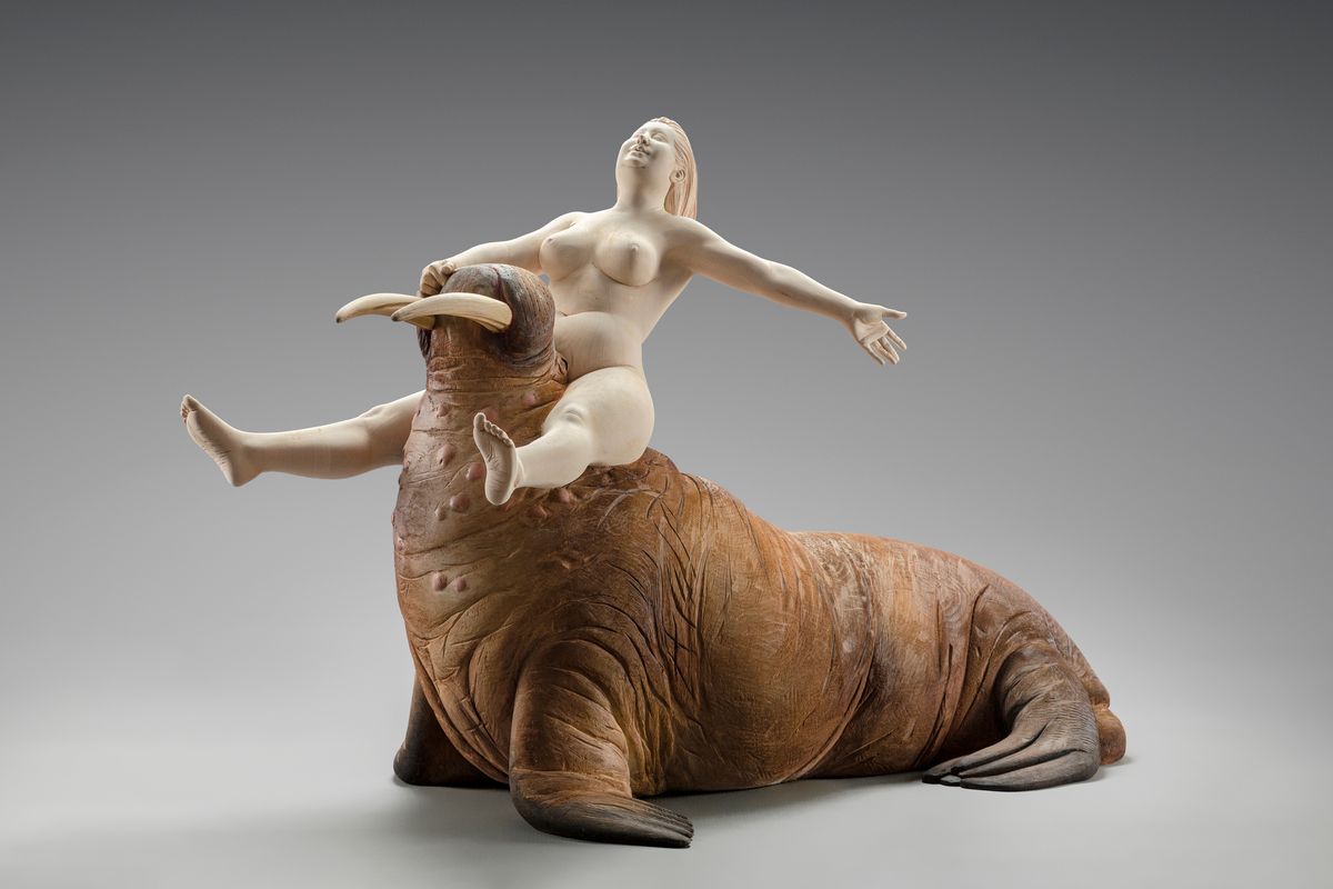 Woman riding a walrus