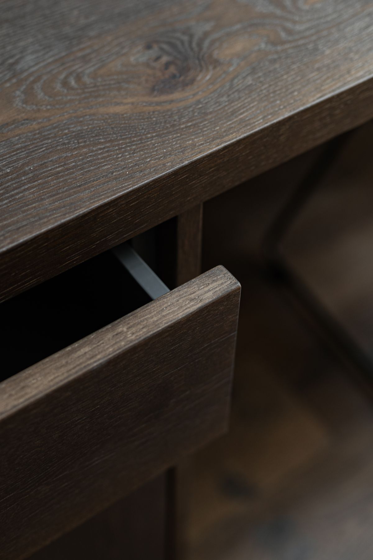 Dark wooden drawer in detail
