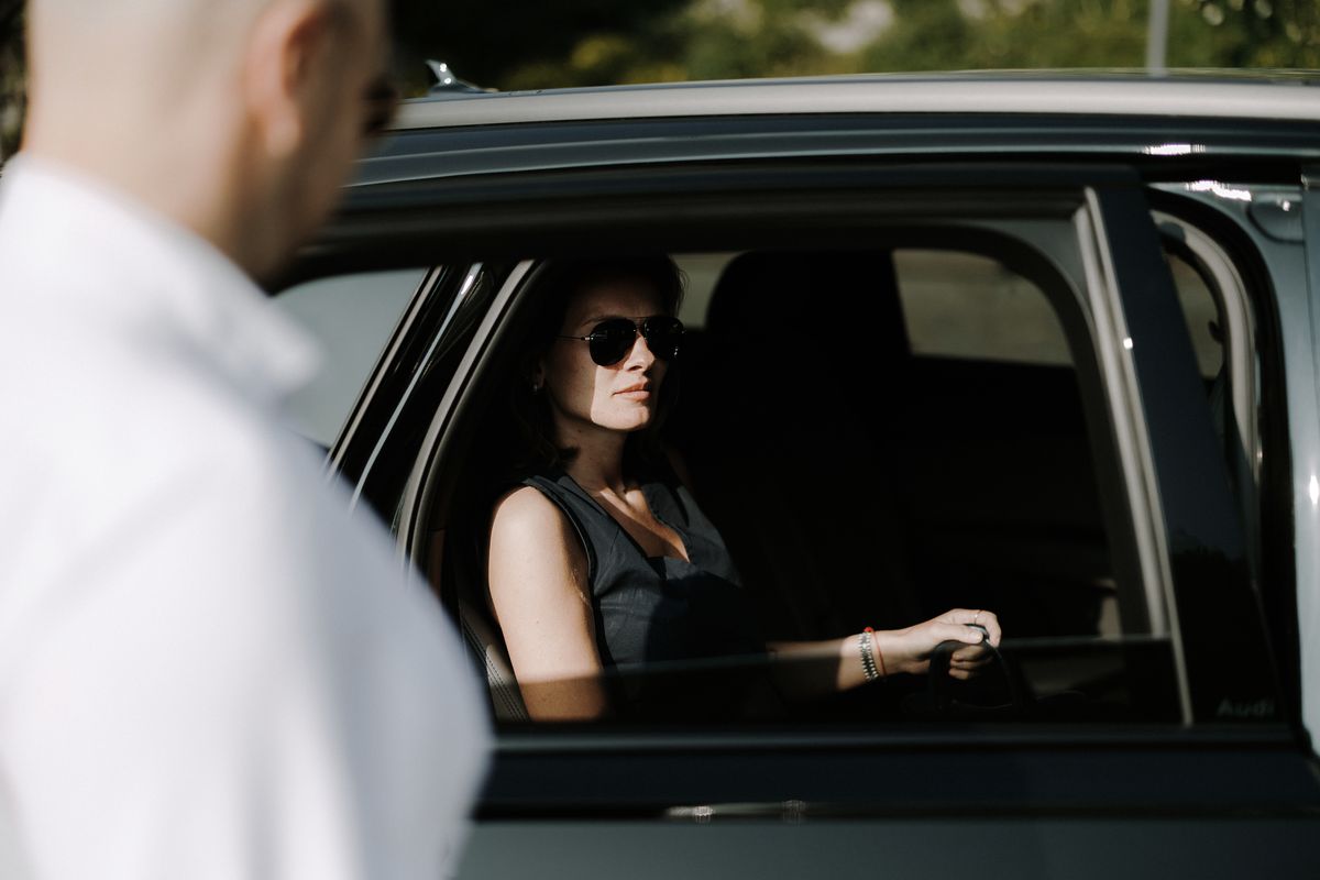 Guest in the back seat, driver at the door
