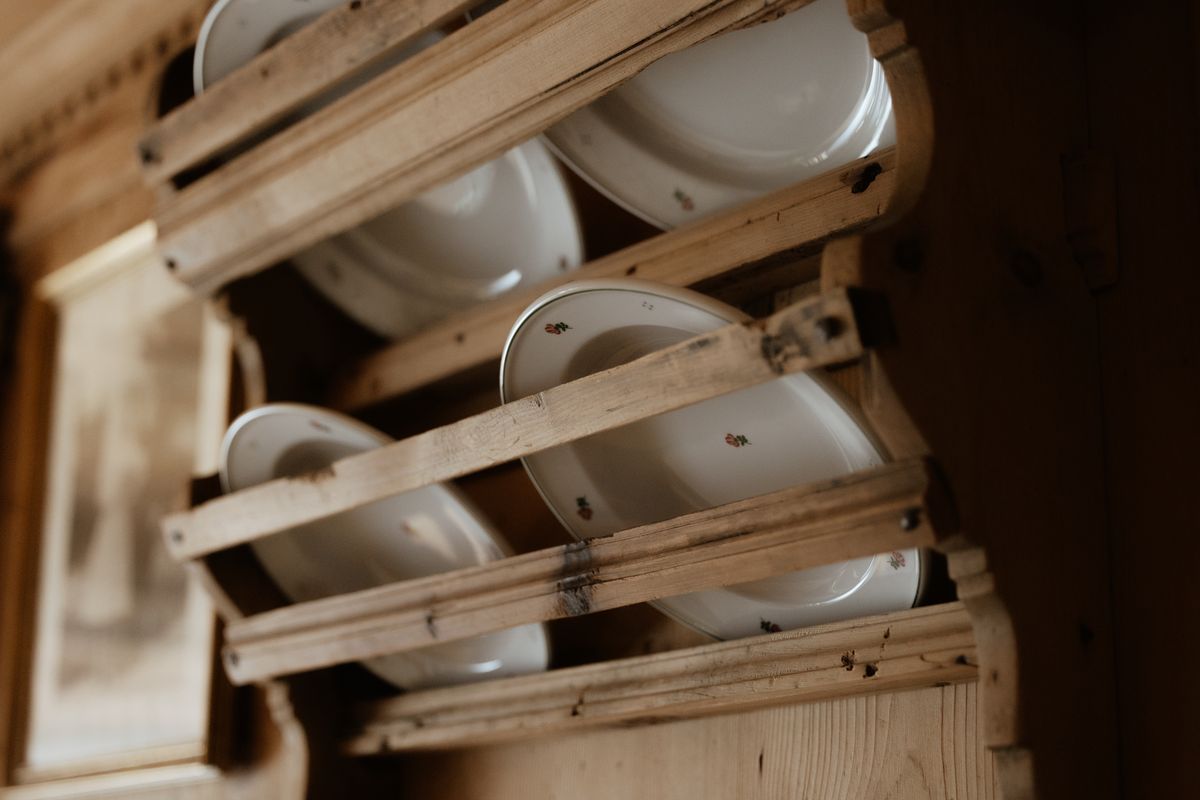 Plates in the old wooden rack