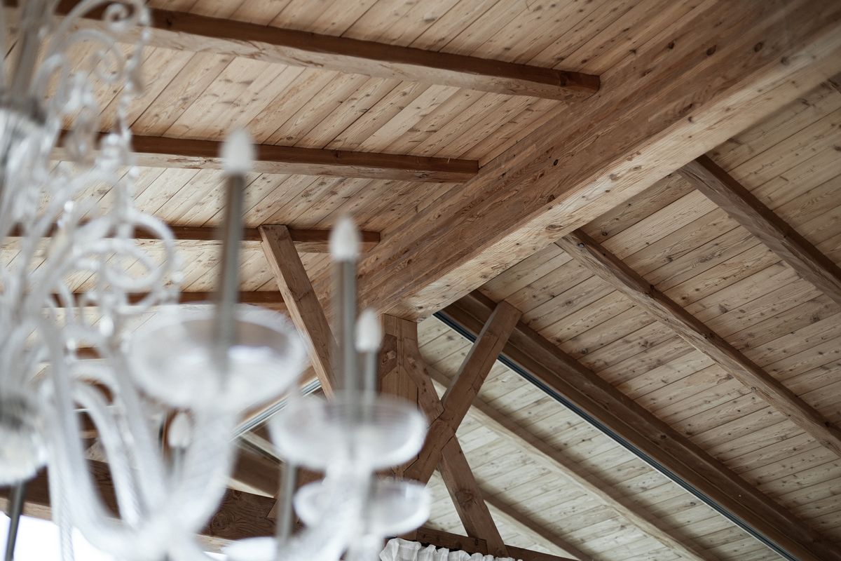 Chandelier beneath the roof beams