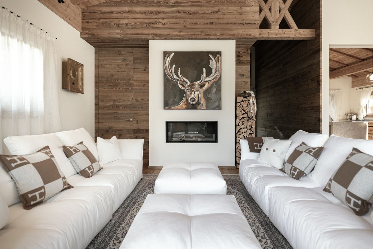 Living room with white sofas and fireplace