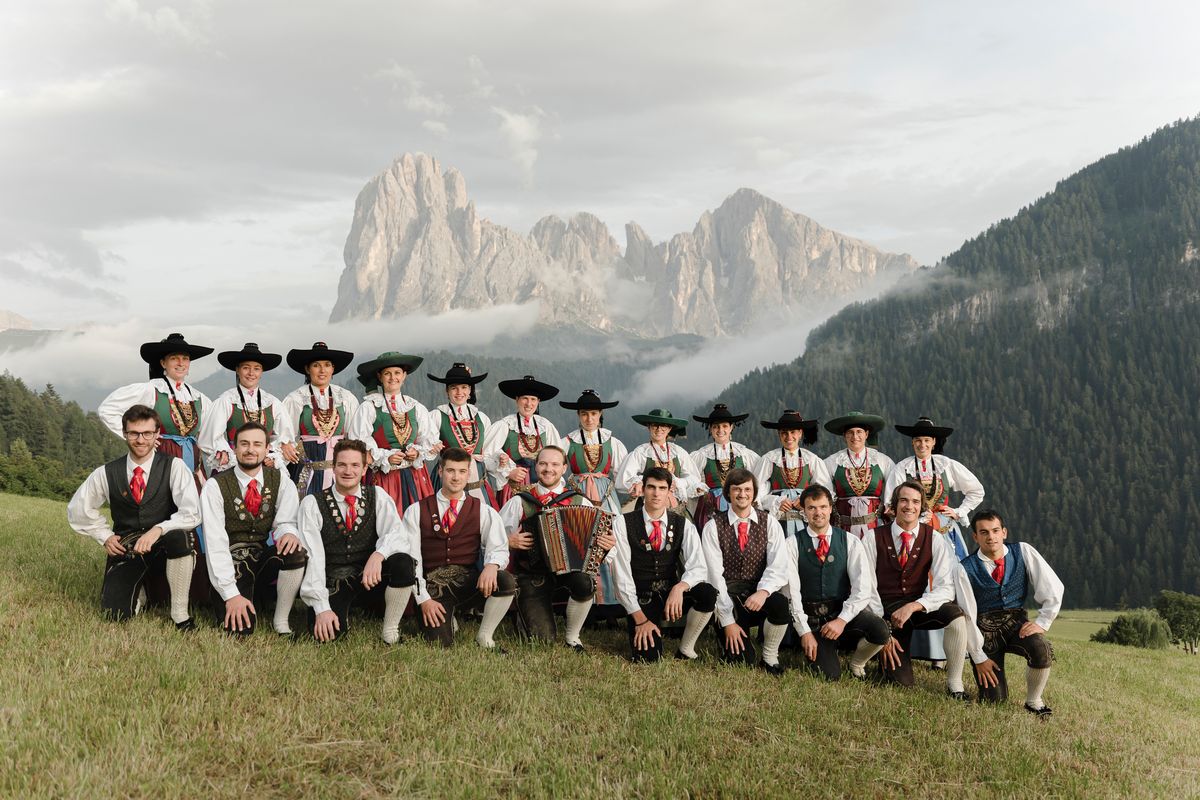 Group photo in traditional dress on the meadow