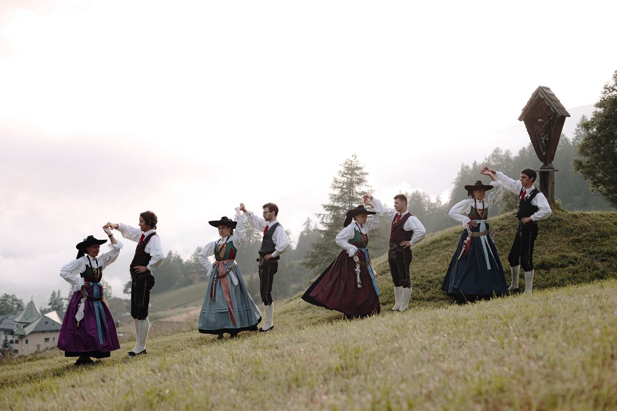 Couples dancing on the meadow