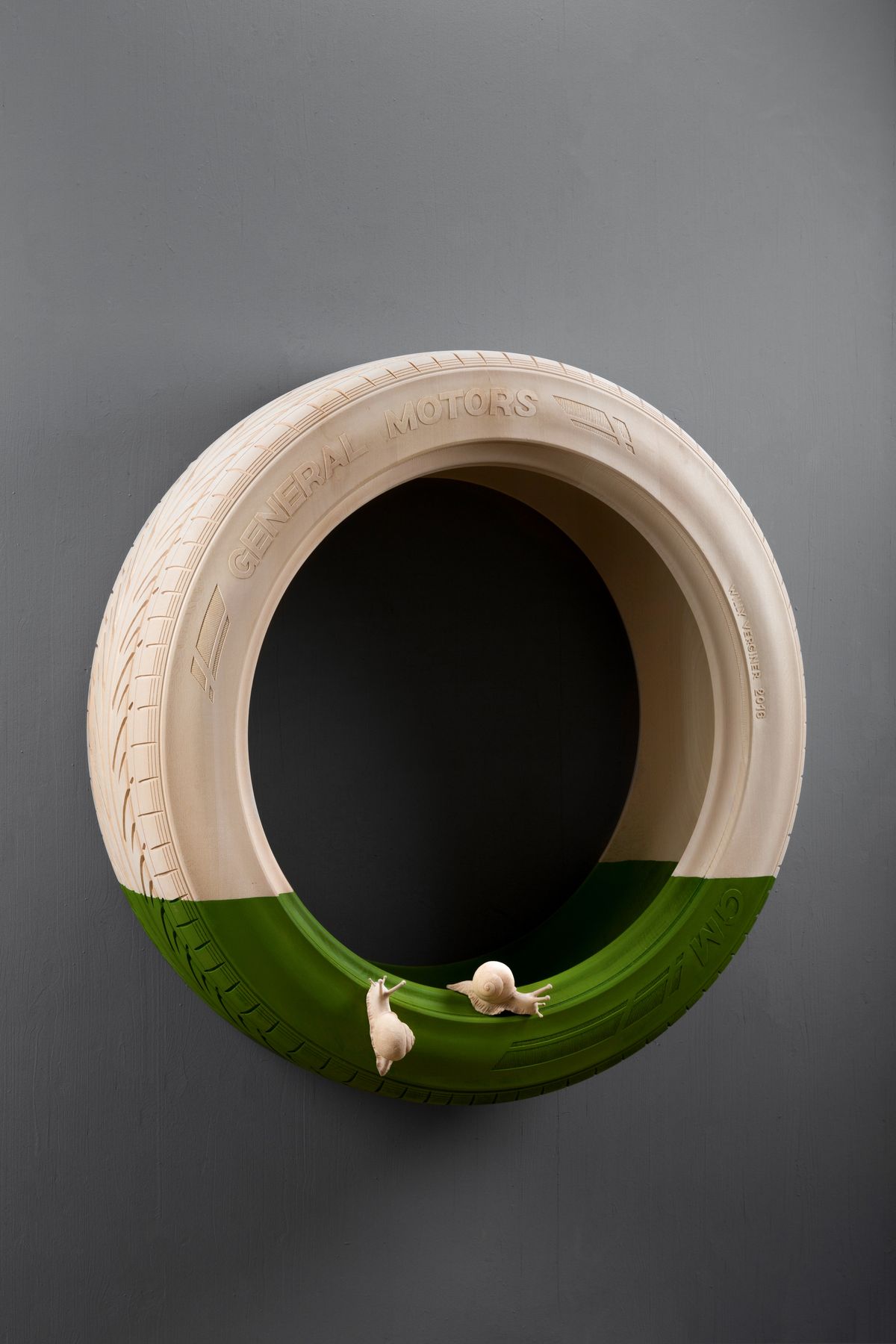 Wooden tyre with a small figure