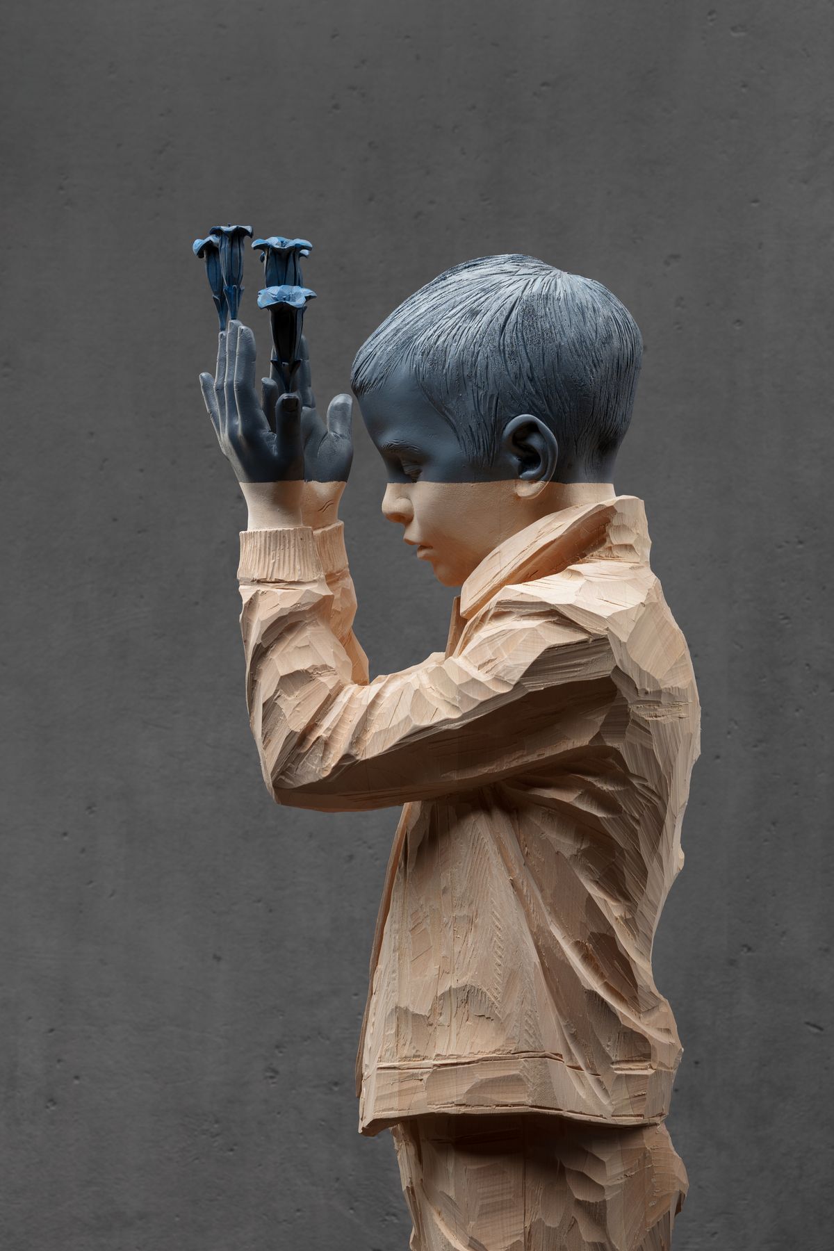 Boy with hands over his eyes