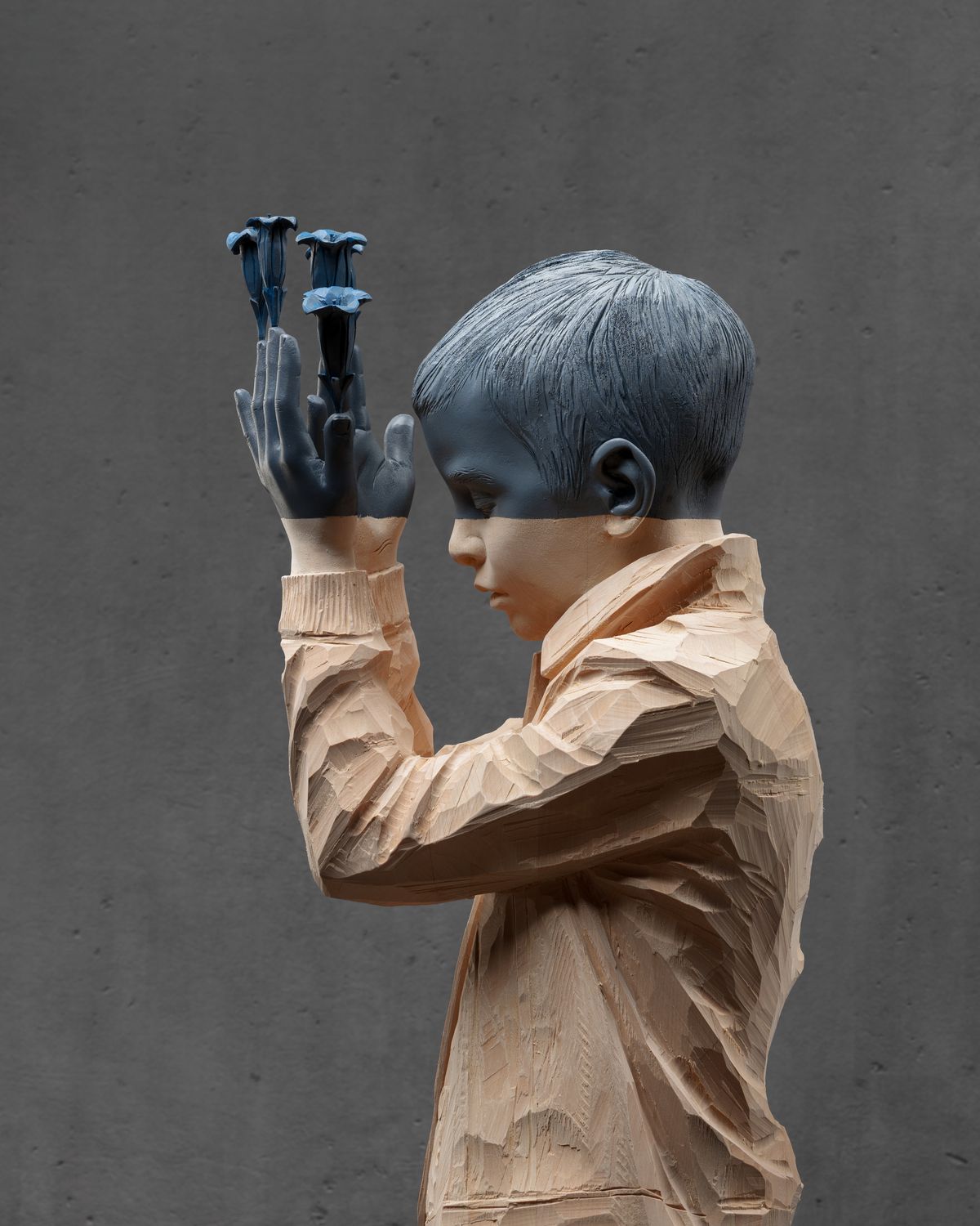 Boy with hands over his eyes