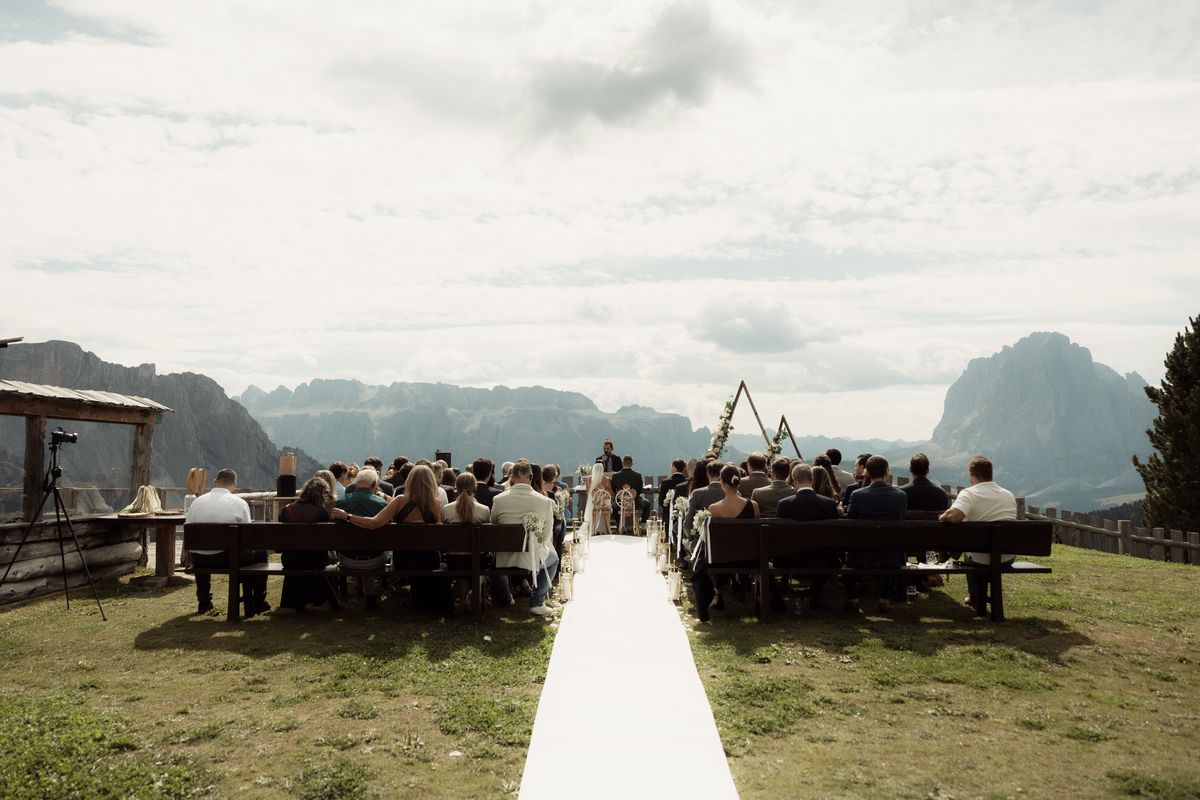 Symbolic ceremony on an alpine pasture facing the Dolomites