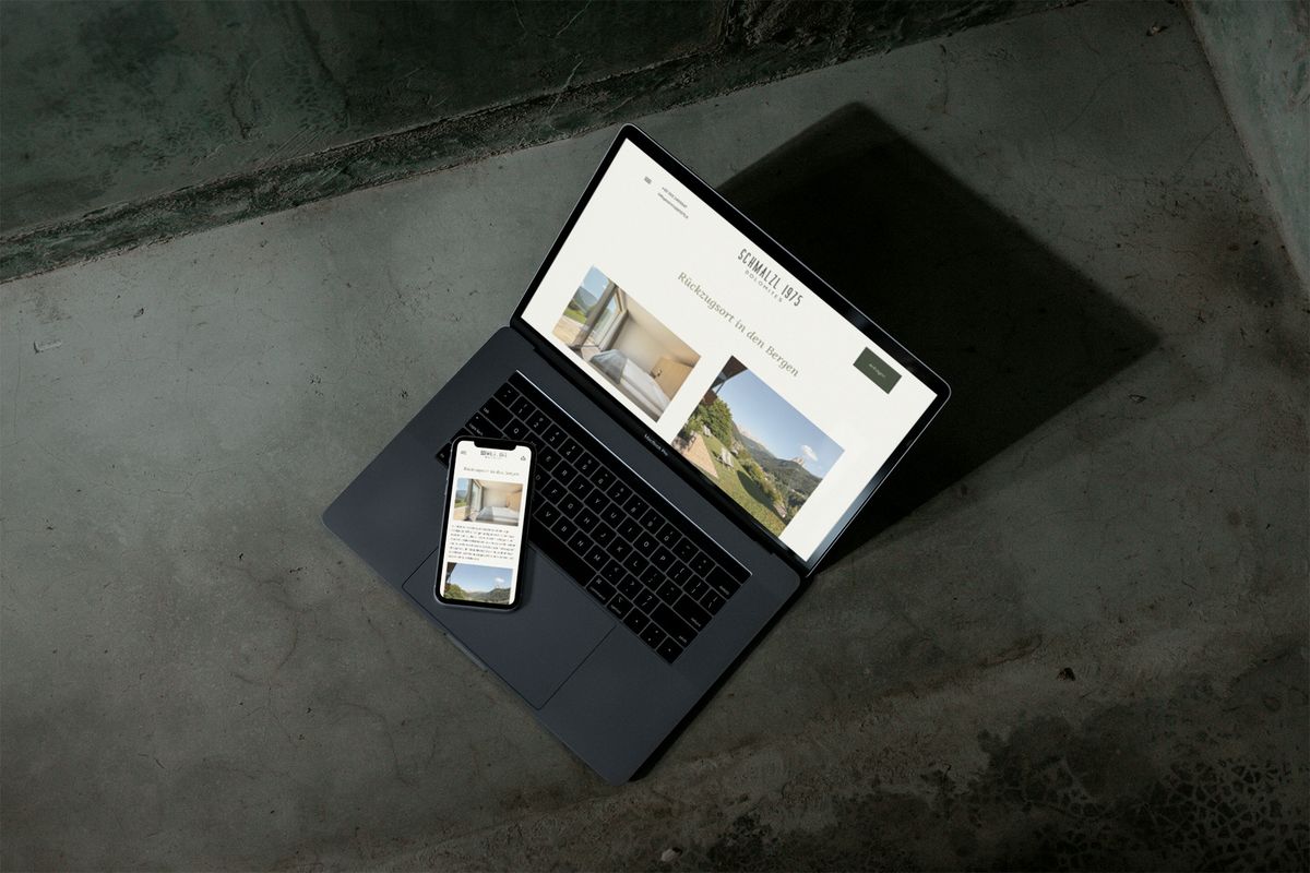 SCHMALZL 1975 website on a laptop and a smartphone