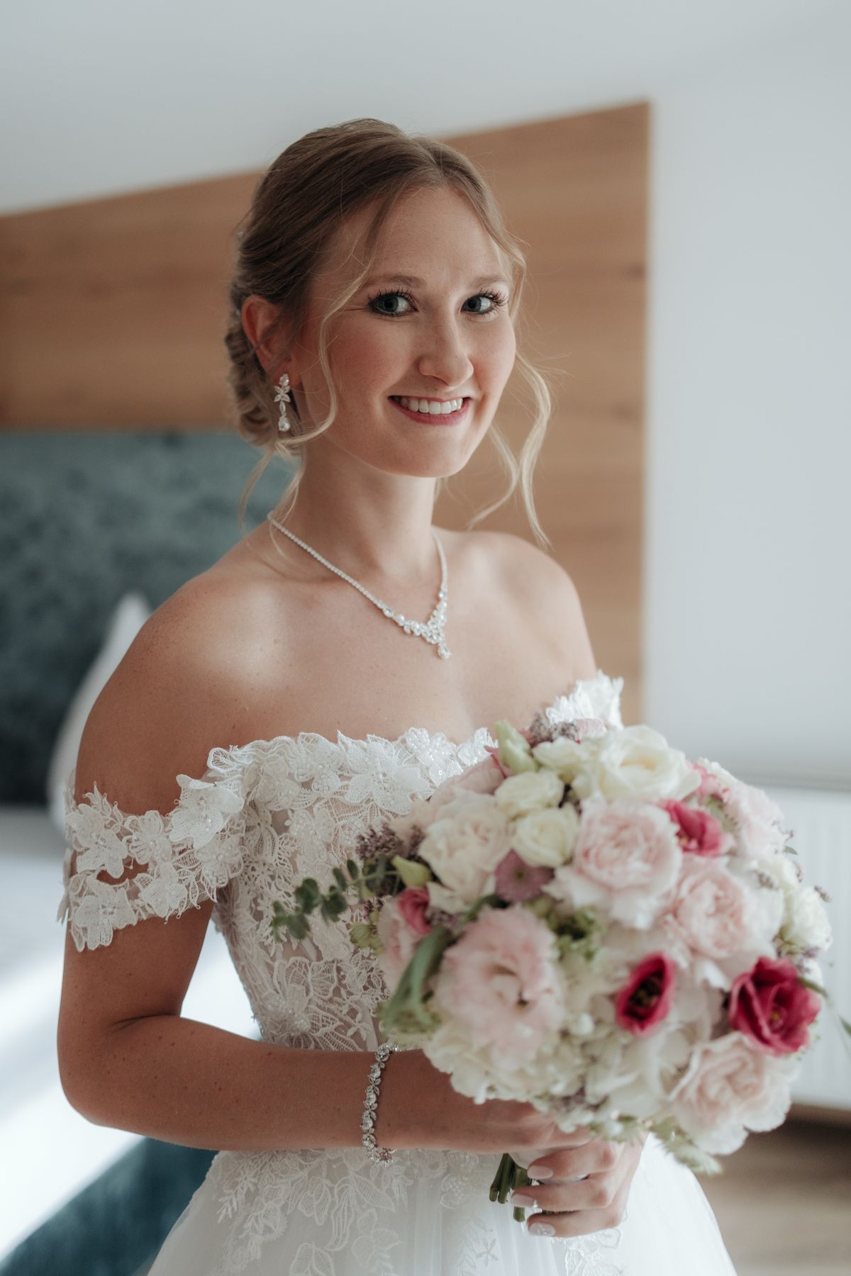 Bride with her bouquet in the hotel room