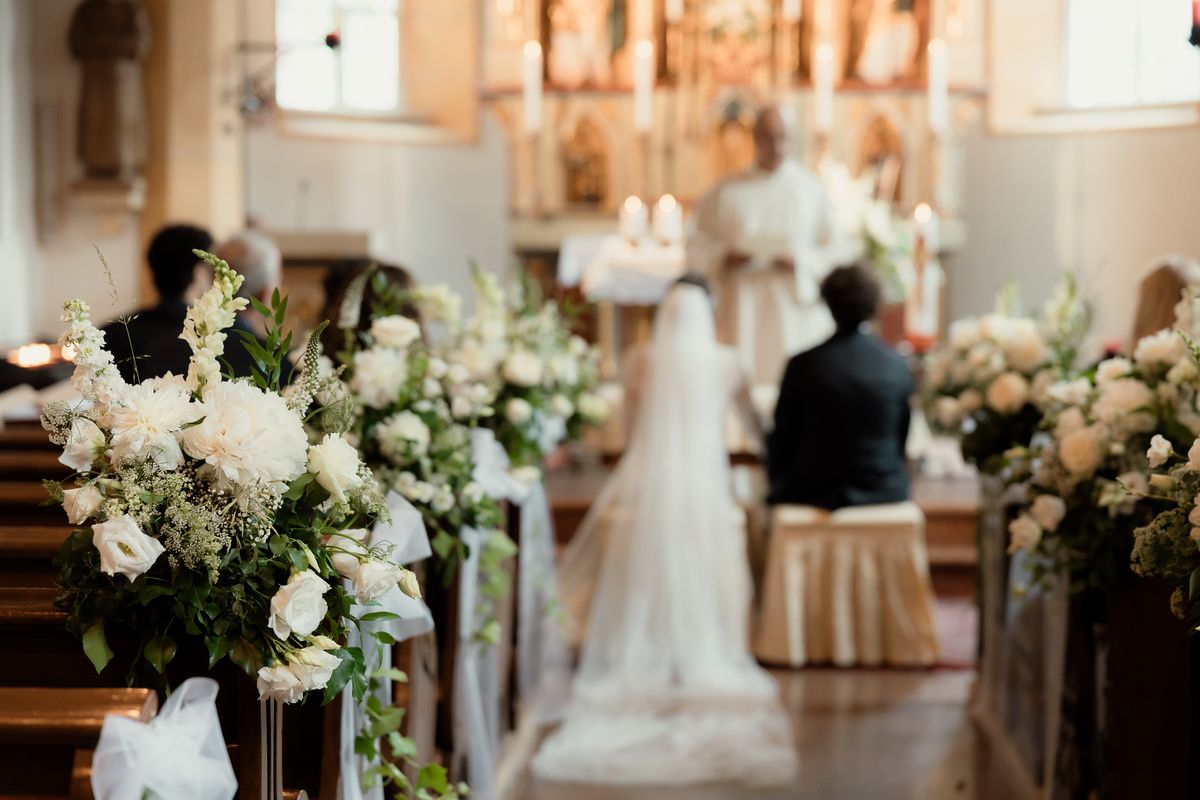 Ceremony in a church decorated with flowers