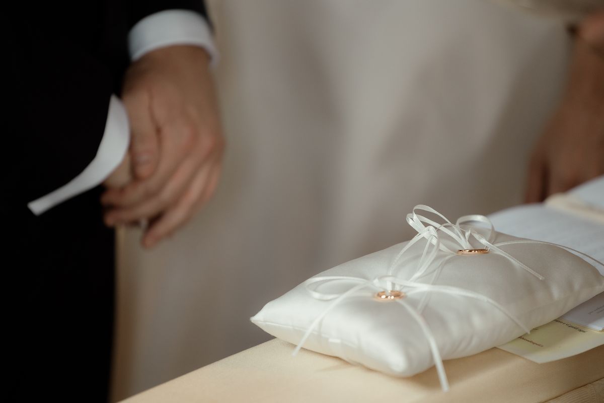 Ring cushion in the groom’s hand