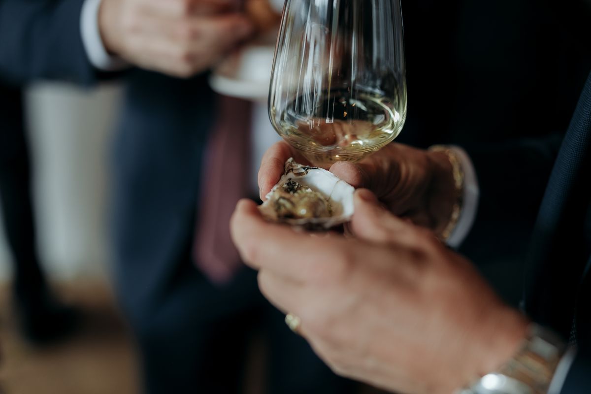Guests toasting with white wine