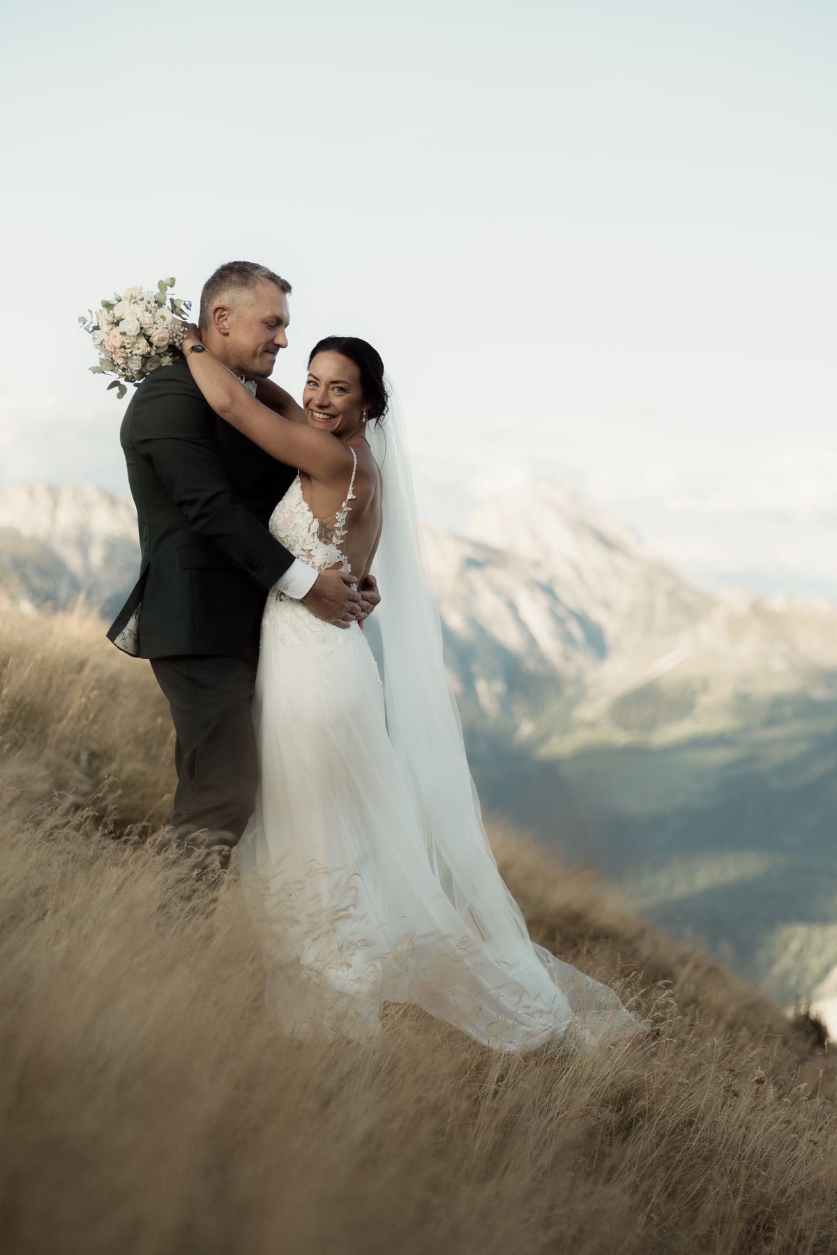 Couple embracing on a mountain meadow