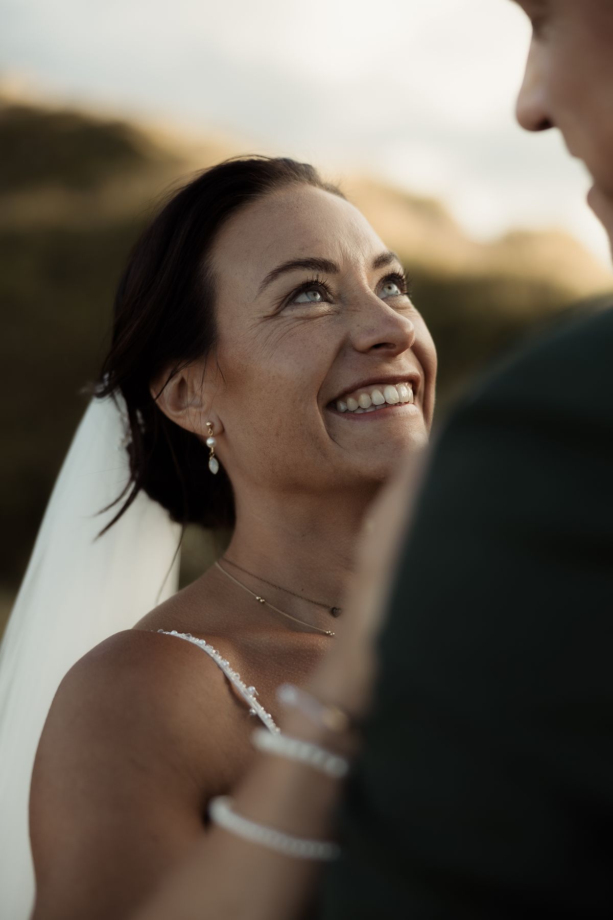 Bride laughing at the groom in the evening light