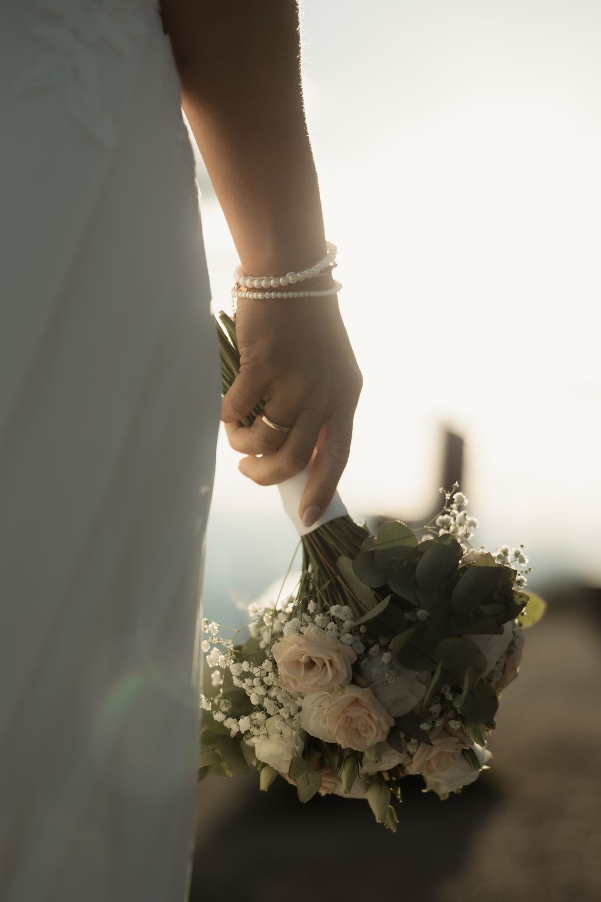 Bride holding her bouquet against the light